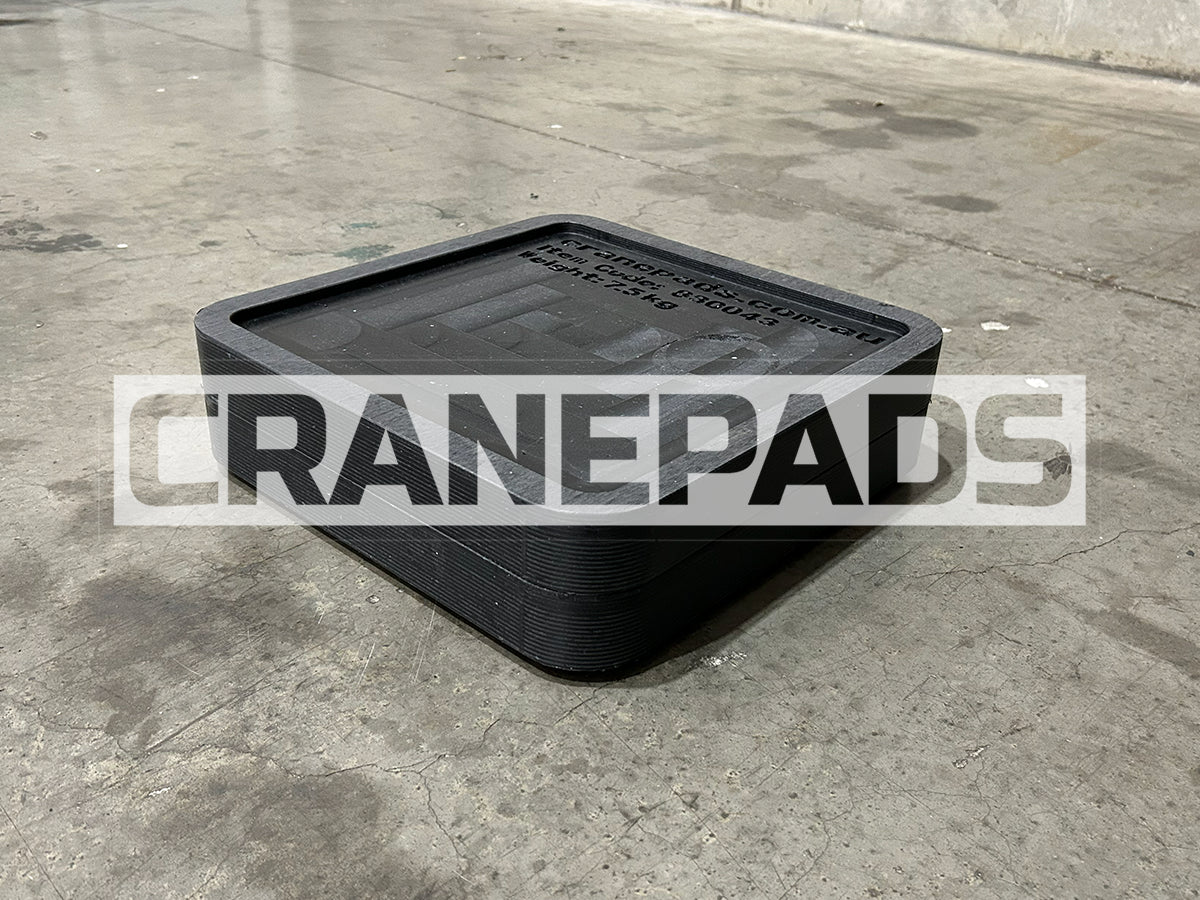 Black rubber mat on a concrete floor with 'CRANEPADS' branding.