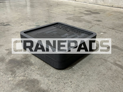 Black rubber mat on a concrete floor with 'CRANEPADS' branding.